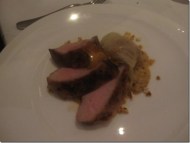 berkshire pork loin over creamed corn at woodfire grill